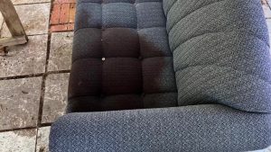 Home Invasion in Blackman Eddy showing a bloodstained sofa