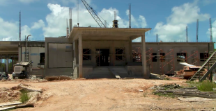 Ambergris Hospital Delayed, Costs Soar Beyond Budget