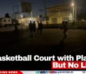 A Basketball Court with Players But No Lights