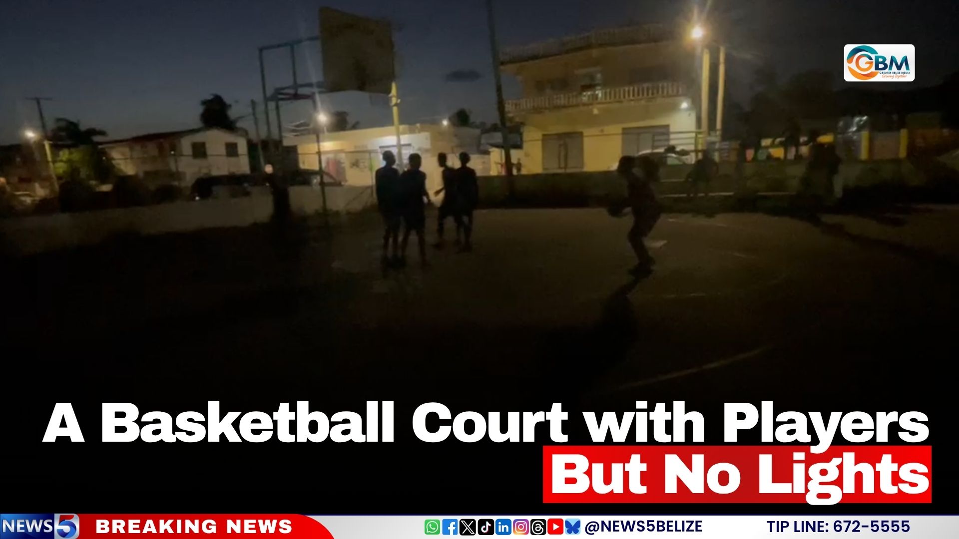 A Basketball Court with Players But No Lights